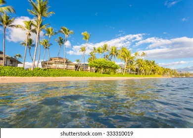 Vacation Cottages On The Beach With Palms, Maui, Hawaii.