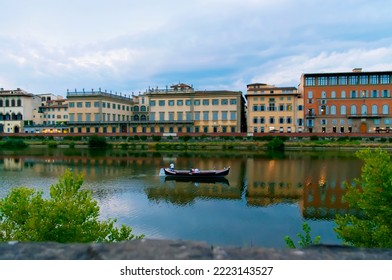 Vacation in Florence on the Arno River. People at niki tourism. Evening rest with sunset view. Boat holidays on the Arno River