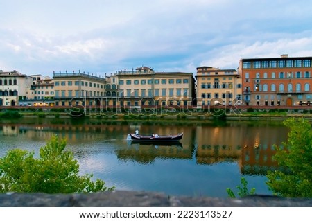 Vacation in Florence on the Arno River. People at niki tourism. Evening rest with sunset view. Boat holidays on the Arno River