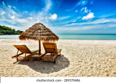 Vacation holidays background wallpaper - two beach lounge chairs under tent on beach. Sihanoukville, Cambodia - Shutterstock ID 289370486