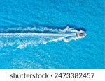 Vacation and leisure. Aerial view on fast boat on azure sea at sunny day. Fast ship on the sea surface. Seascape from the drone. Seascape from air. Seascape with motorboat.