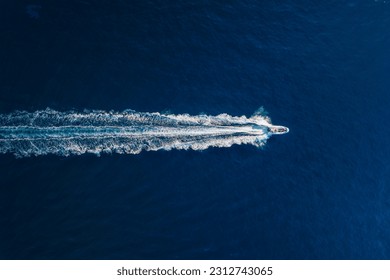 Vacation and leisure. Aerial view on fast boat on blue Mediterranean sea at sunny day. Fast ship on the sea surface. Seascape from the drone. Seascape from air. TSeascape with motorboat. - Powered by Shutterstock