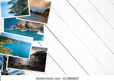 Vacation Pictures On A Wooden White Table. View From Above.