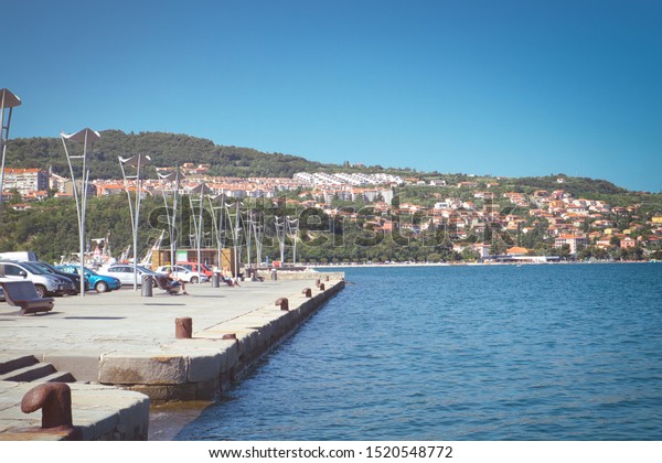 Vacation relax and\
the city parking of cars on the Adriatic sea coast in Coper\
(Capodistria) resort in\
Slovenia