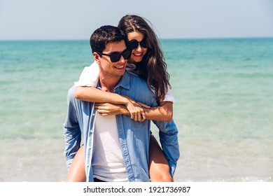 Vacation Romantic Love Young Happy Couple Hug And Standing On Sand At Sea Having Fun And Relaxing Together On Tropical Beach.Summer Vacations