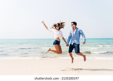 Vacation Romantic Love Young Happy Smile Couple In Honeymoon Travel Holiday Trip Standing On Sand At Blue Sky Sea Beach Having Fun And Relaxing Together On Tropical Beach.Summer Travel