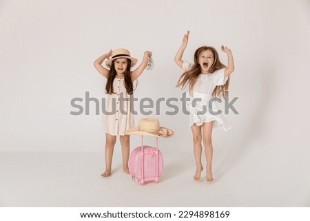 Vacation time concept. Beautiful happy kids smiling isolated on white background. Tourists going to summer vacation.Travel trip funny.Two Friend happy travel .