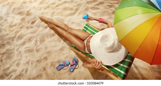 Vacation. Travel. Beautiful Young Woman Relaxing On Beach Chair With Cocktail. Top View