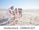 Vacation, travel and big family running on the beach for playing, bonding and spending quality time. Happy, excited and children having fun with their grandparents and parents by the ocean on holiday