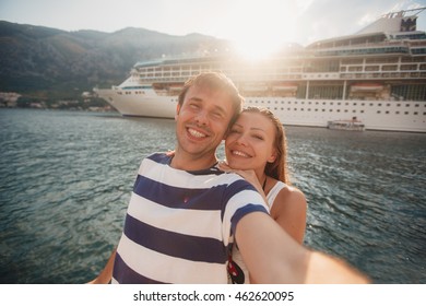 Vacation, Travel, Sea, Friendship And People Concept - Smiling Couple By Sea Yachts. Love, Travel, Tourism And People Concept - Smiling Couple Wearing Sunglasses Walking At Harbor. Rich And Attractive