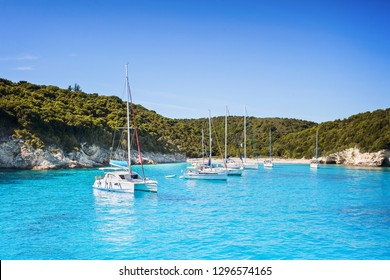 Vacations In Greece. Beautiful Bay With Sailing Boats Yachts Near The Antipaxos Island