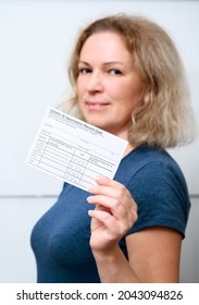 Vaccinated Young Woman Showing COVID-19 Vaccination Record Card, Happy Person After Getting Corona Virus Vaccine. Concept Of Coronavirus Vaccine Shot, Immunization Certificate, Proof And People.