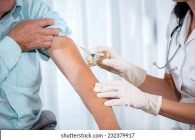 Vaccinating An Elderly Person - Powered by Shutterstock