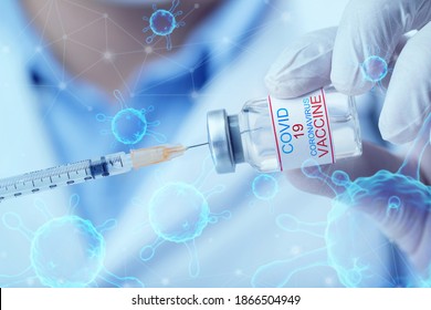 Vaccination against the new Coronavirus SARS-CoV-2. Doctor holding Corona virus vaccine and syringe using for prevent COVID-19 infection.
