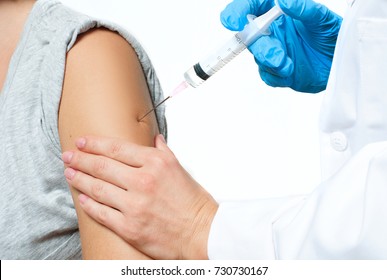 Vaccination. Doctor Injecting Flu Vaccine To Patient's Arm.  Doctor Making Woman An Injection