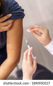 Vaccination Healthcare Concept - Hands Of Doctor Or Nurse Hold A Syringe And Ampule Preparing A Shot Of Corona Virus Covid-19 Hpv Or Flu Vaccine For Unknown Patient Arm - Copy Space Close Up