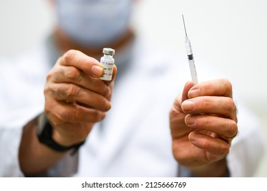 Vaccination Illustration, A General Practitioner In His Office, holds A Vial And A Syringe With A Vaccine, Before Vaccinate A Patient.