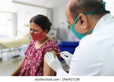 Vaccination In India, Medical Worker Or Doctor Giving Vaccine Injection To A Mature Woman At Hospital To Protect From Coronavirus Or Covid-19. Omicron Cases In India