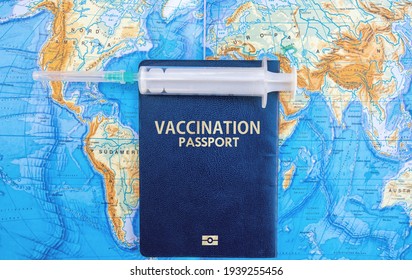 Vaccination Passports On World Map With Vaccine. Covid-19 Travel Concept