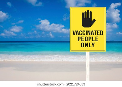 A vaccination required sign at a beach or seaside resort. Vaccinated people only permitted to enter premises. Travel regulation. - Shutterstock ID 2021724833