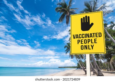 A vaccination required sign at a beach or seaside resort. Vaccinated people only permitted to enter premises. Travel regulation. - Shutterstock ID 2021724839