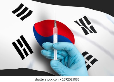 Vaccination In South Korea. Vaccine To Protect Against Covid-19 On Background Of National Flag.