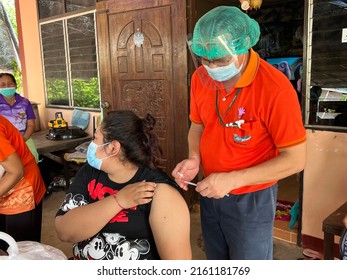 Vaccinator team at hospital or vaccination center draws up Covid-19 vaccine in syring, Medical procedure , 27 May 2022 , Buriram province.