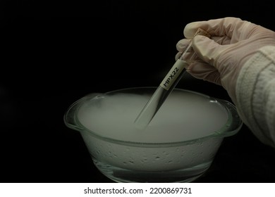 Vaccine Against Monkey Pox Virus Inside Tube Held By Gloved Hand Extraction At Minus 72 Degrees From Dry Ice