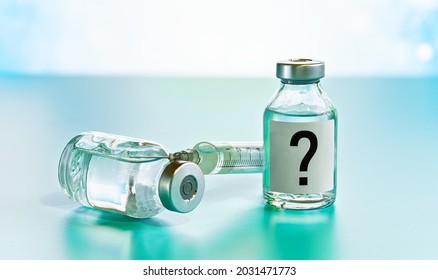 Vaccine Bottle With Hypodermic Syringe Needle Near, Question Mark On Label, Unknown Side Effects Of Experimental Treatment Concept