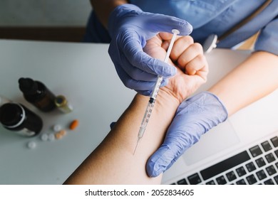 vaccine Concept fight against virus covid-19 corona virus, doctor or scientist in laboratory holding a syringe with liquid vaccines for children or older adults, diseases, medical care, science.