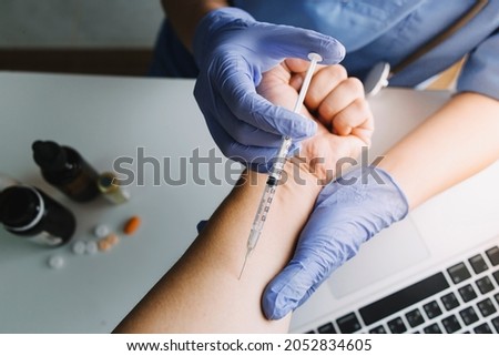 vaccine Concept fight against virus covid-19 corona virus, doctor or scientist in laboratory holding a syringe with liquid vaccines for children or older adults, diseases, medical care, science.