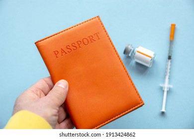 Vaccine concept with passport, syringe and ampoule international certificate of vaccination traveling abroad during coronavirus pandemic, new flight ban rules travel, aviation business