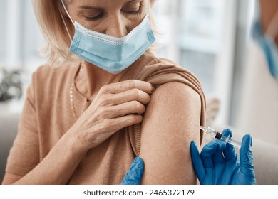 Vaccine, doctor and senior woman on sofa for needle at medical consultation by nursing home. Syringe, checkup and hands of healthcare worker with elderly female patient for injection at house. - Powered by Shutterstock