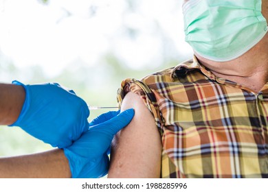 Vaccine Medical.Asian Old Senior Man 60 Old Getting Vaccinated Immunity In Clinic.vaccine Program, Recommended Inoculation, Vaccination, American Black Doctor Vaccine Vaccinated Patient.Coronavirus.