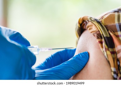 Vaccine Medical.Asian Old Senior Man 60 Old Getting Vaccinated Immunity In Clinic.vaccine Program, Recommended Inoculation, Vaccination, American Black Doctor Vaccine Vaccinated Patient.Coronavirus.