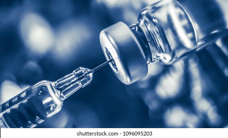 Vaccine Vial Dose Flu Shot Drug Needle Syringe,medical Concept Vaccination Hypodermic Injection Treatment Disease Care Hospital Prevention Immunization Illness Disease  Baby Child.blue Background 