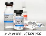 Vaccine for virus in small bottles closeup photo