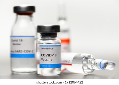 Vaccine for virus in small bottles closeup photo - Shutterstock ID 1912064422