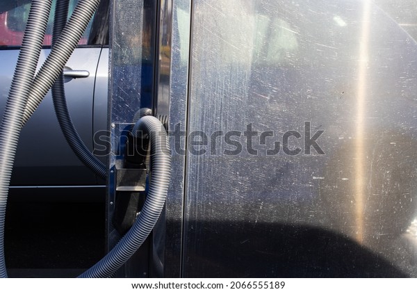 Vacuum\
cleaner in a compartment at a car wash close\
up