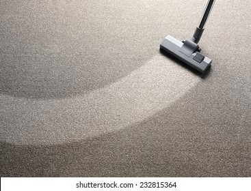 Vacuum Cleaner On A Carpet With An Extra Clean Strip For Copy Space 