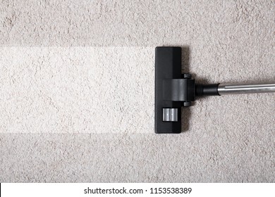 Vacuum Cleaner On Carpet Indoors, Closeup. Cleaning Service