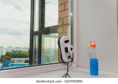 Vacuum cleaner robot cleaning window in high building outdoor. - Shutterstock ID 1507092890