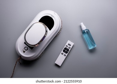 Vacuum Cleaner Robot Washing Glass Window. Robot Assistant At Home For Cleaning Windows Or Mirrors.