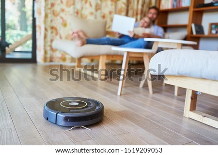 Vacuum cleaner vacuuming on floor in living room Stock photo © 