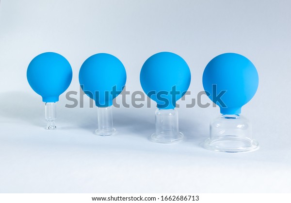 Vacuum jars for face fitness and\
anti-wrinkles face massage cans isolated on a white\
background
