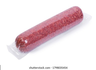 Vacuum packed salami sausage isolated on white