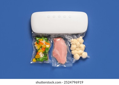 Vacuum sealer machine for food with chopped vegetables, mushrooms and meat in packs on blue background - Powered by Shutterstock