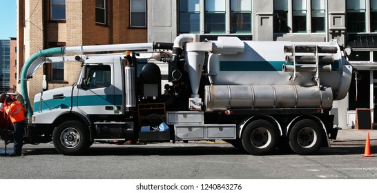 Vacuum tanker working on street of Hoboken. New Jersey. USA.