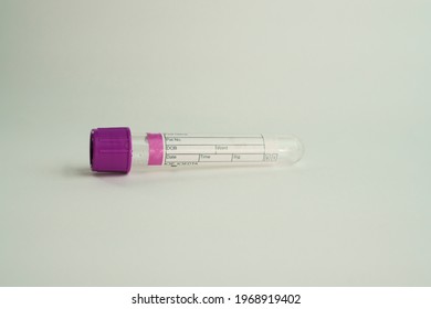 vacuum tube for collection and blood samples on white background.Transparent with purple lid. Label to identify the data. Selective focus. lid. Label to identify the data. Selective focus.