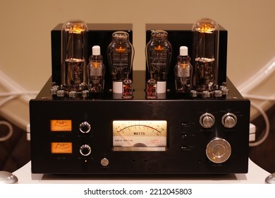 Vacuum tube stereo amplifier. Hi end power amplifier with glowing bulb diode lamp for sound reproduction, Natural sound concept, Electronic vacuum tube or glowing tubes in antique radio               